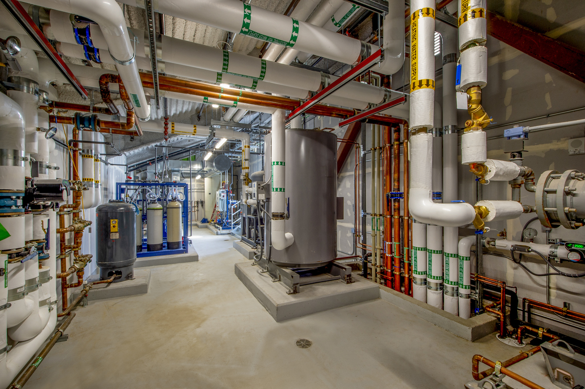 Pipes and water tanks in room